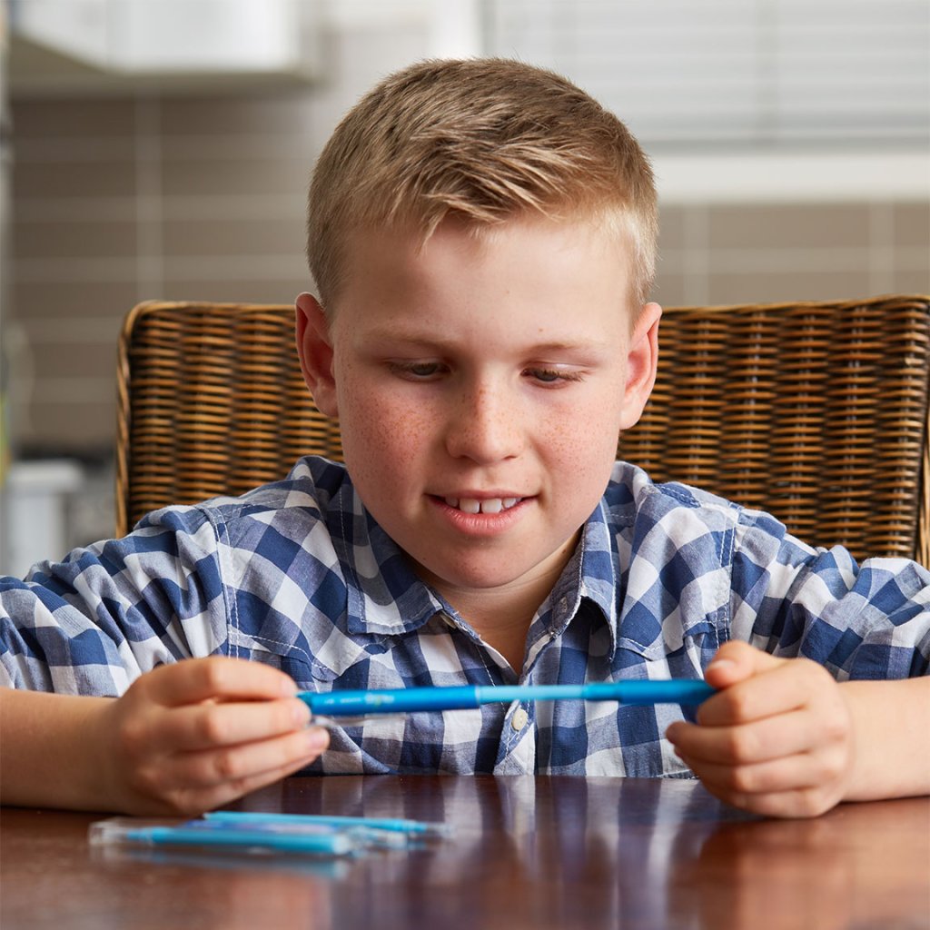 Line of FriXion Erasable Gel Pens by Pilot Pen being used by school boy.